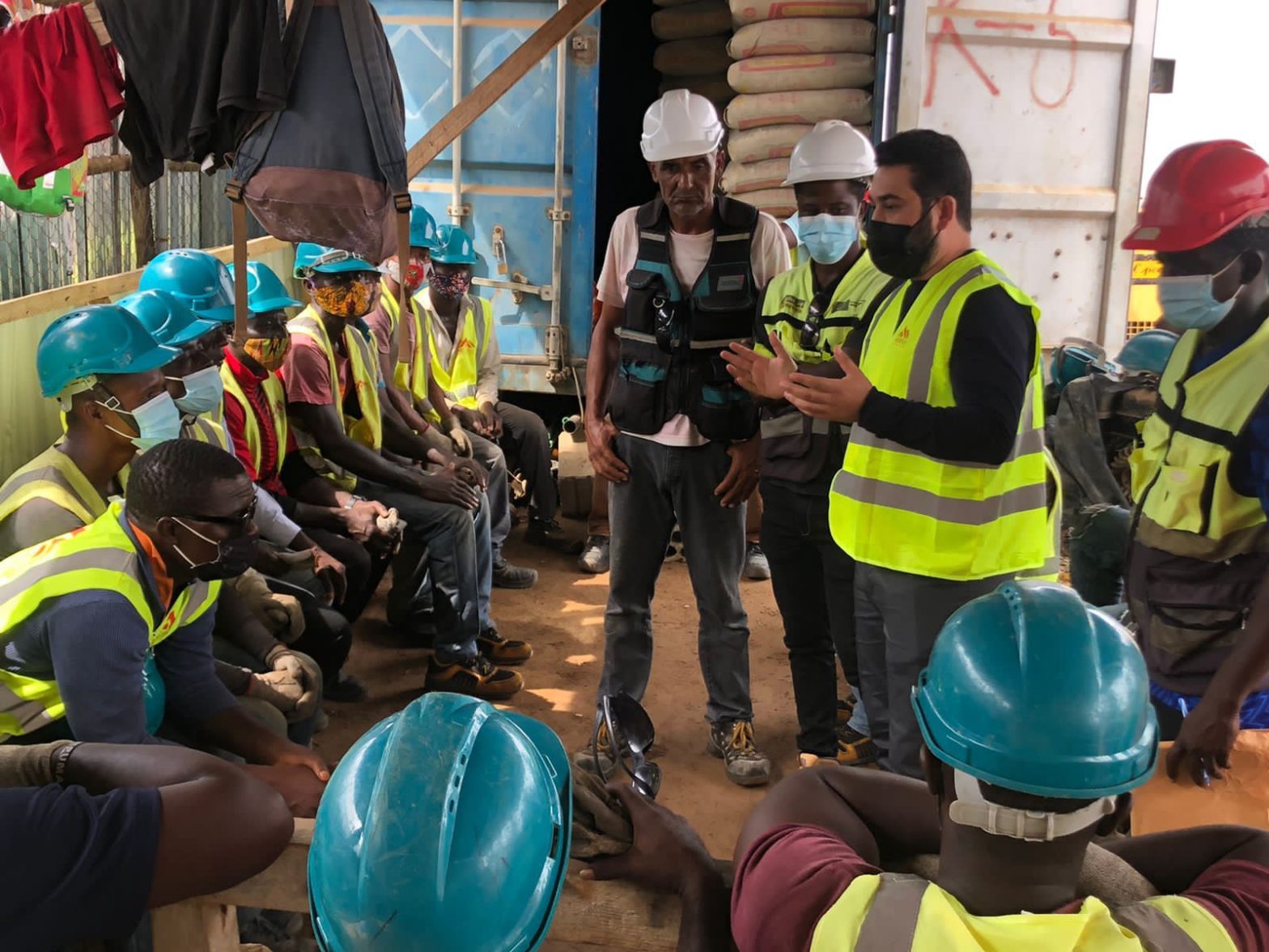 People in PPE being briefed